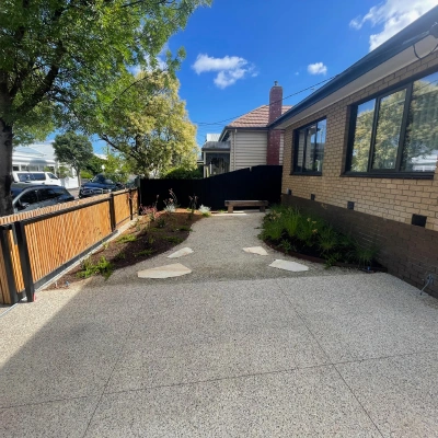 Exposed aggregate driveway with a garden path