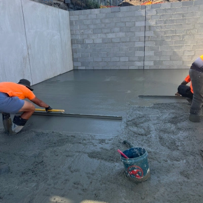 TT Constructions crew screeding a fresh concrete slab