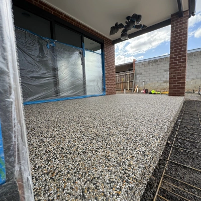 Exposed aggregate patio at a brick home