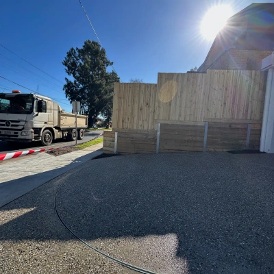 Dark exposed aggregate driveway at a Melbourne site
